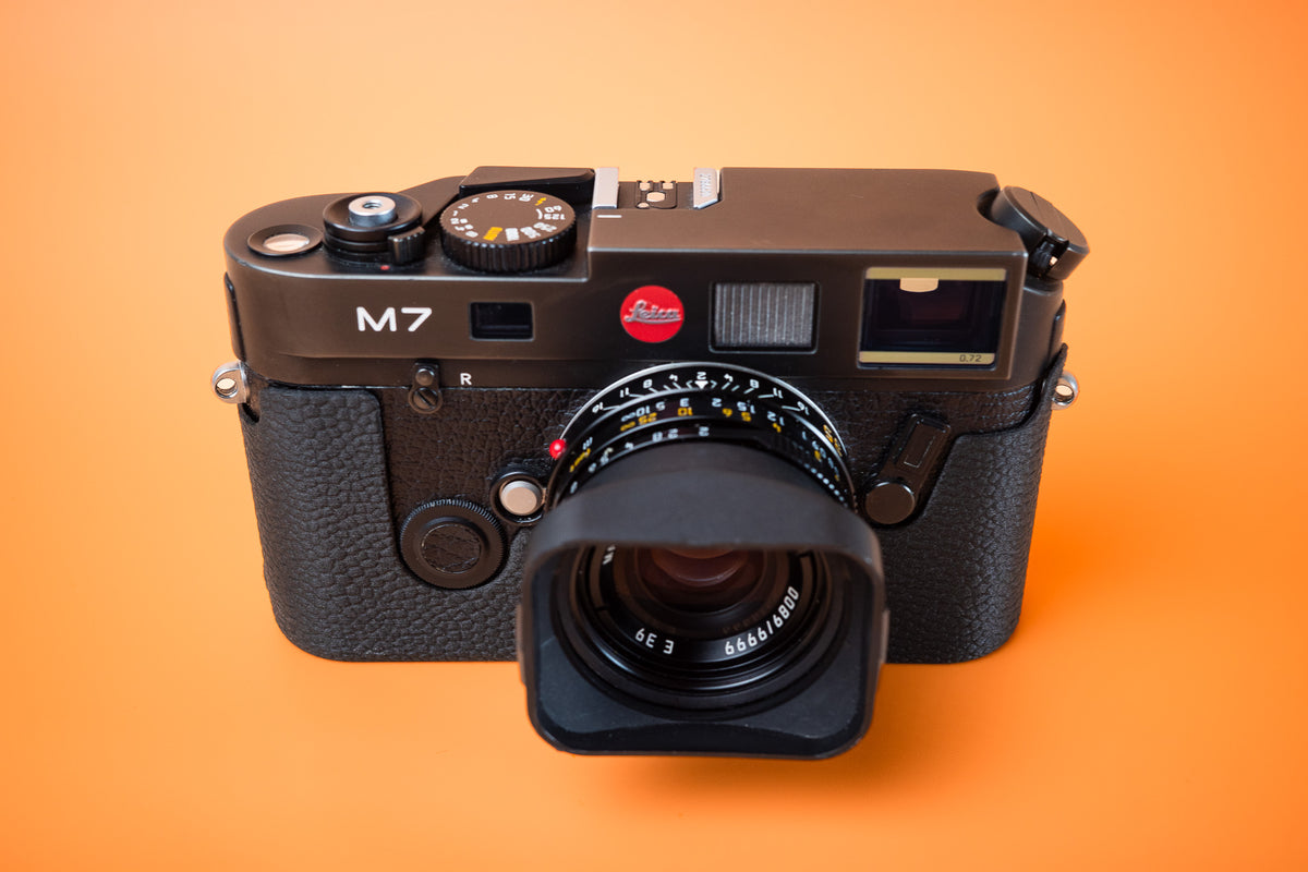 Akara Labs Leica M7 TPU Slim Skin case. Front view no grip standard version. Orange background.