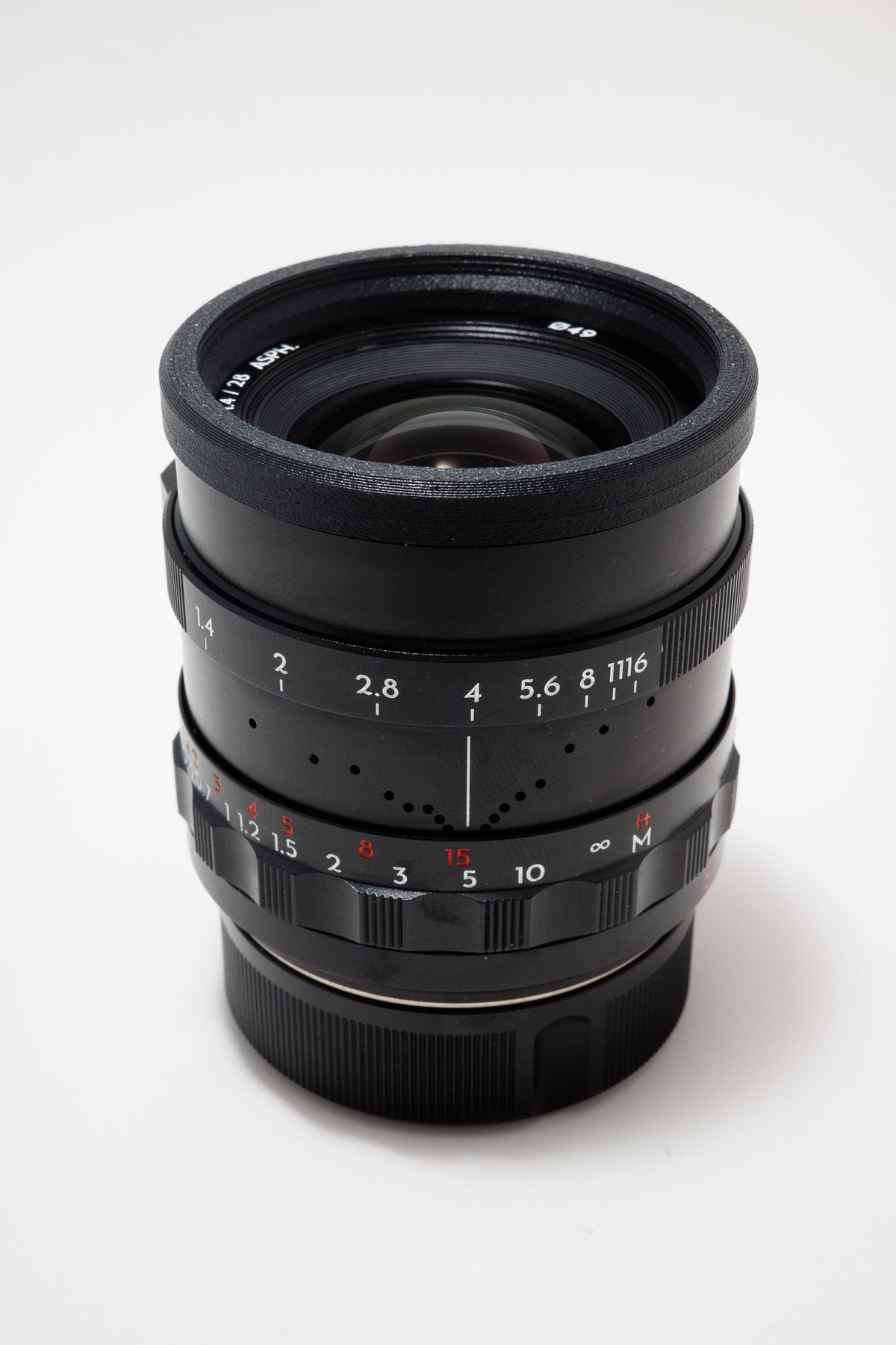 Lens Stealth Ring 49mm mounted on Thypoch 28mm lens